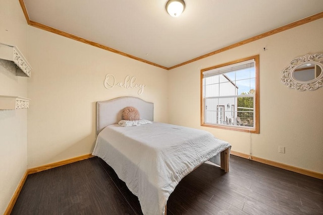 bedroom with crown molding and dark hardwood / wood-style floors