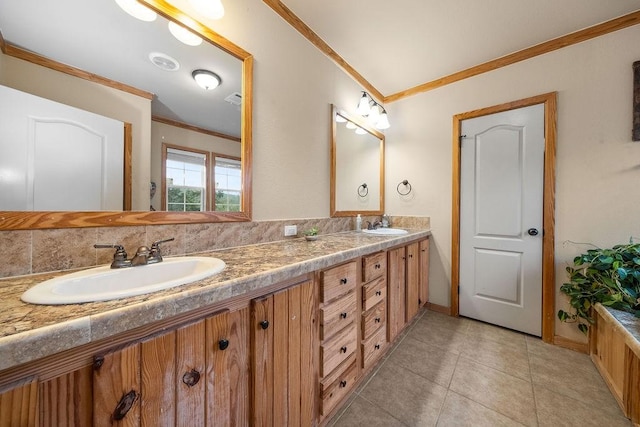 bathroom featuring vanity, tasteful backsplash, tile patterned floors, and ornamental molding