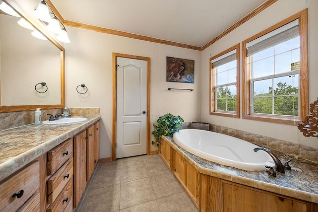 bathroom with tile patterned floors, vanity, a bathtub, and ornamental molding