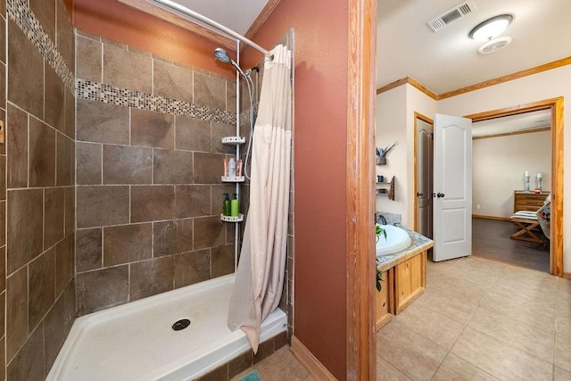 bathroom featuring a shower with curtain, vanity, and crown molding