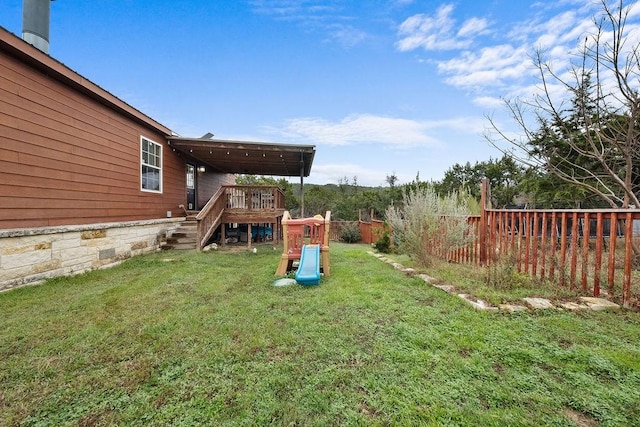 view of yard featuring a wooden deck