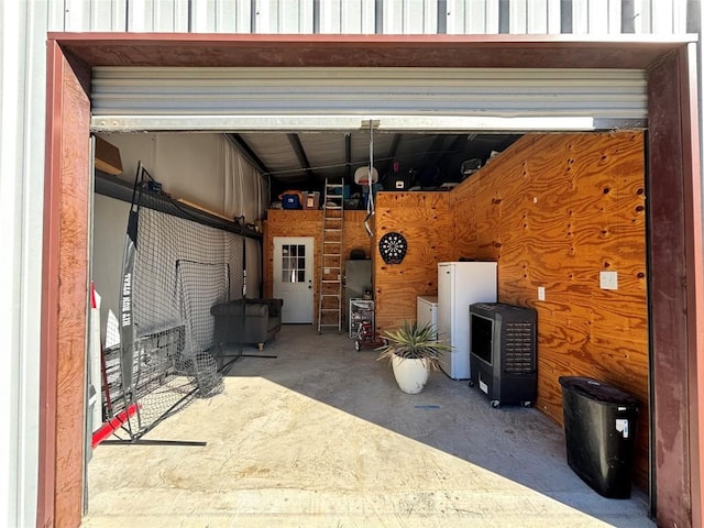 garage with white fridge