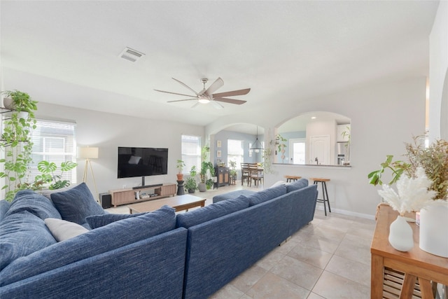 living room featuring ceiling fan and light tile patterned floors