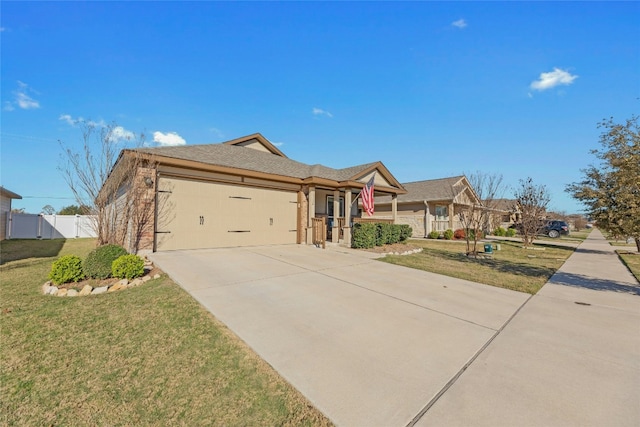 ranch-style home featuring a garage and a front lawn