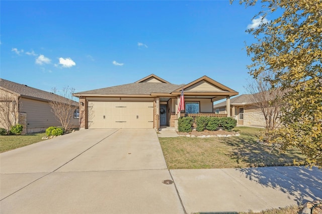 single story home featuring covered porch, a front yard, and a garage