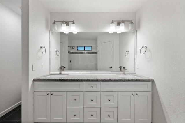 bathroom featuring vanity and a shower with door