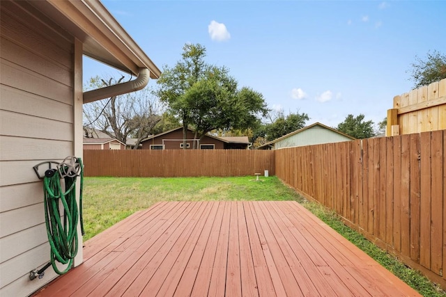 wooden terrace with a yard