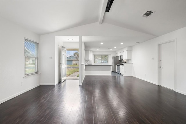 unfurnished living room with lofted ceiling with beams and dark wood-type flooring