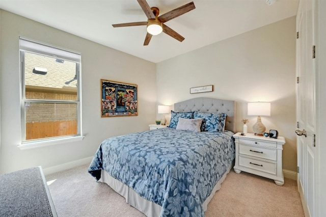 bedroom featuring ceiling fan and light colored carpet