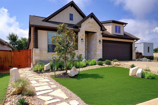 view of front facade with a garage and a front yard