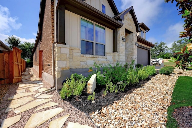 view of side of home with a garage