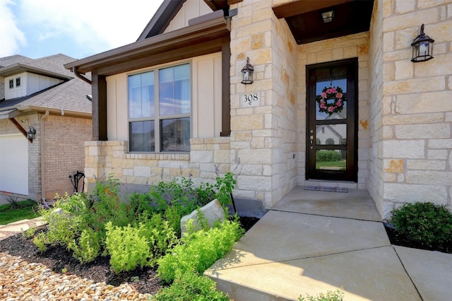 doorway to property with a garage