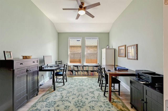 office with ceiling fan, light hardwood / wood-style floors, and vaulted ceiling