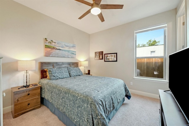 bedroom with ceiling fan and light carpet