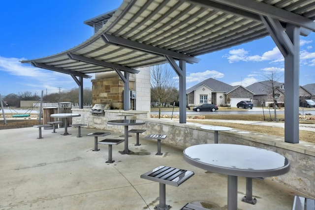 surrounding community with an outdoor kitchen