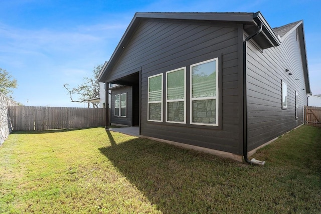 view of property exterior featuring a lawn