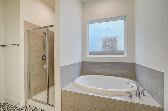 bathroom featuring plus walk in shower