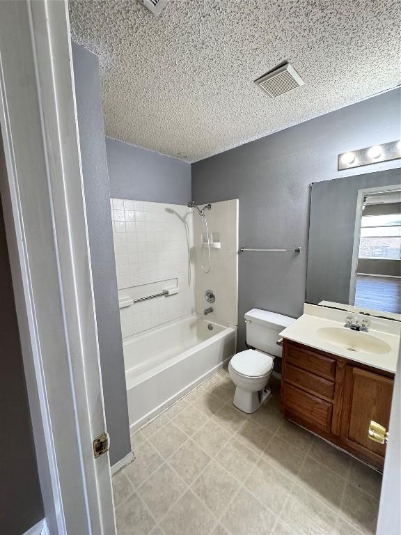 full bathroom featuring vanity, shower / bath combination, and toilet