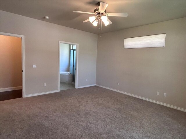 unfurnished bedroom featuring connected bathroom, carpet floors, and ceiling fan