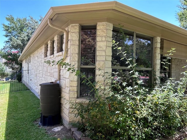 view of side of property with a yard