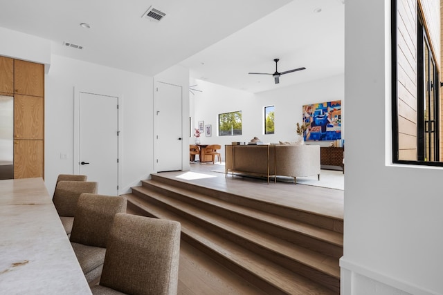 interior space featuring ceiling fan