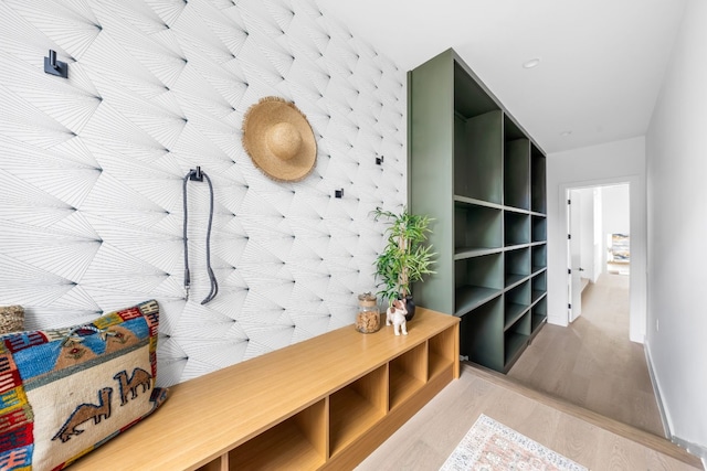 mudroom with light hardwood / wood-style floors