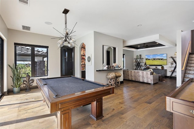 game room with dark hardwood / wood-style floors, ceiling fan, and billiards