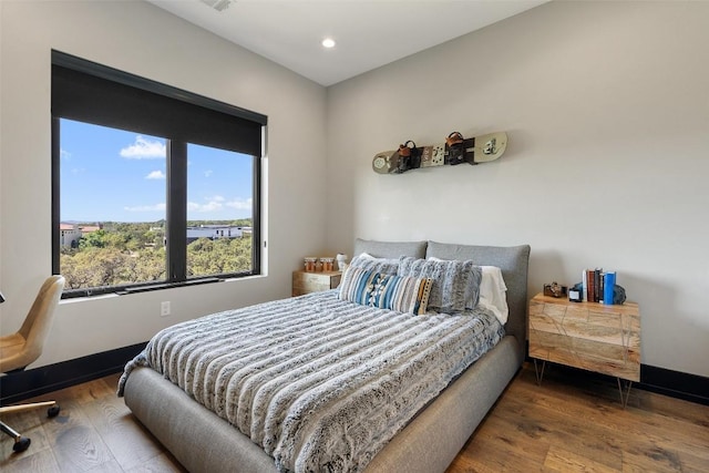 bedroom featuring hardwood / wood-style flooring