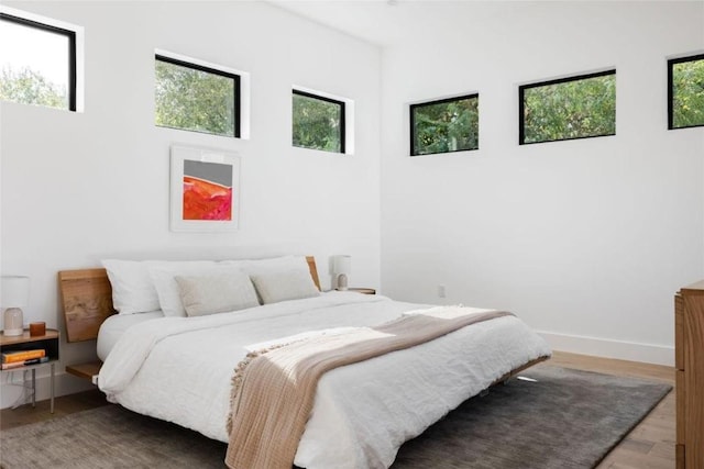 bedroom with wood-type flooring