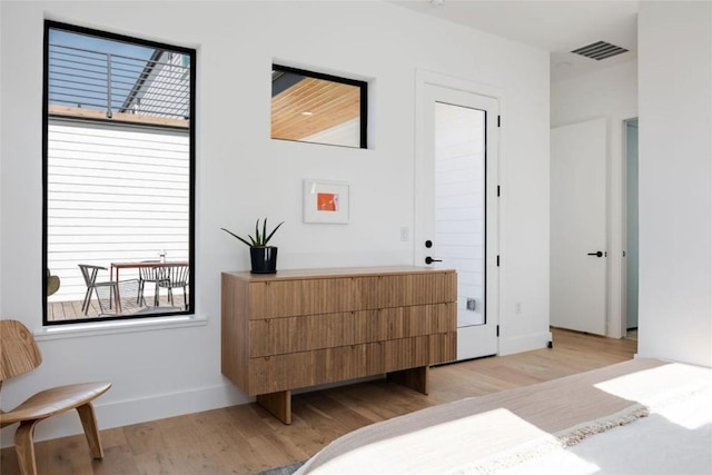 bedroom with light hardwood / wood-style flooring