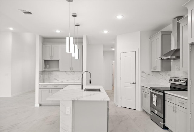 kitchen with light stone countertops, sink, wall chimney exhaust hood, pendant lighting, and stainless steel range with electric stovetop