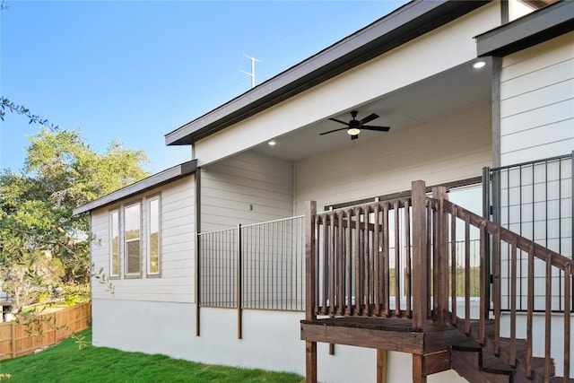 view of side of property featuring ceiling fan