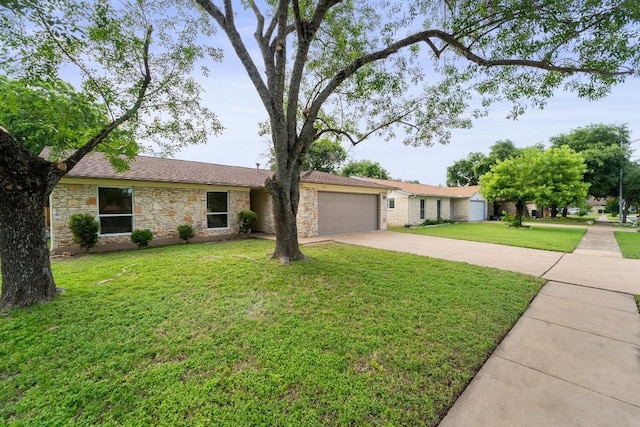 ranch-style home with a front yard and a garage