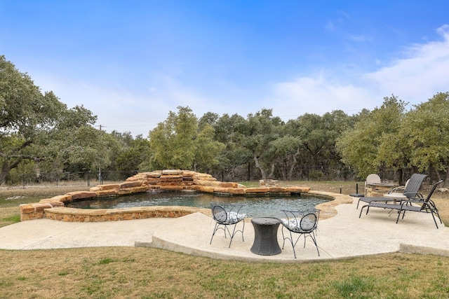 exterior space with a yard, fence, and a patio