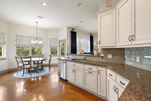 kitchen with visible vents, decorative backsplash, a sink, dishwasher, and baseboards