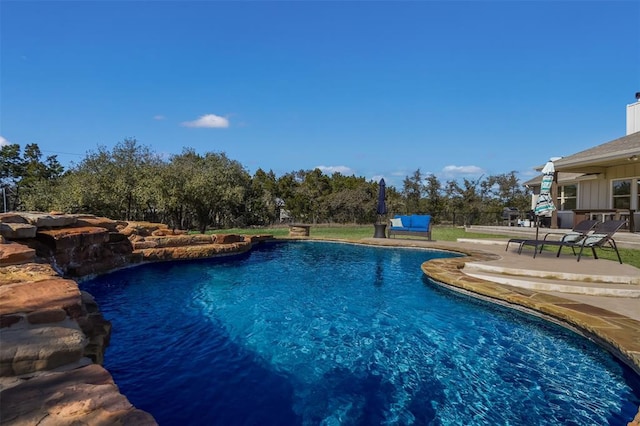 outdoor pool featuring a patio