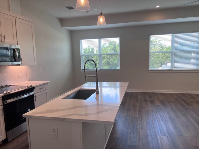 12001 Vista Parke Dr Unit 1202, Austin, TX 78726 - kitchen with appliances with stainless steel finishes, plenty of natural light, dark wood finished floors, decorative backsplash, and recessed lighting