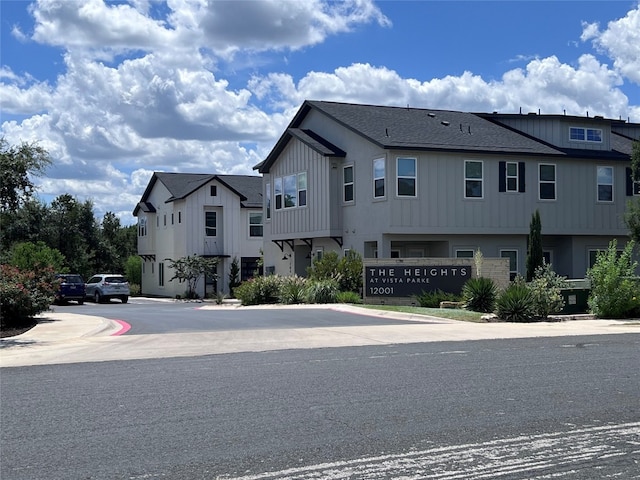12001 Vista Parke Dr Unit 1202, Austin, TX 78726 - view of front of property featuring board and batten siding and a shingled roof