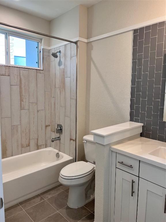 12001 Vista Parke Dr Unit 1202, Austin, TX 78726 - bathroom with tile patterned flooring, vanity, and washtub / shower combination