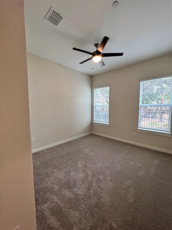 12001 Vista Parke Dr Unit 1202, Austin, TX 78726 - unfurnished room featuring ceiling fan and carpet flooring