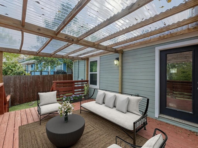 deck with an outdoor hangout area and a pergola