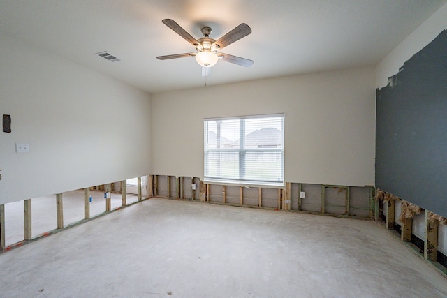 unfurnished room featuring ceiling fan and concrete floors