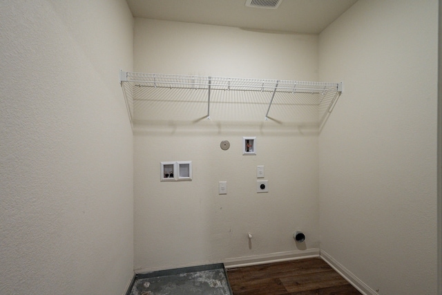 washroom with hookup for a gas dryer, dark hardwood / wood-style floors, hookup for an electric dryer, and hookup for a washing machine