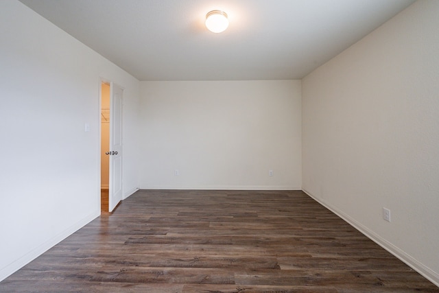 empty room featuring dark hardwood / wood-style floors