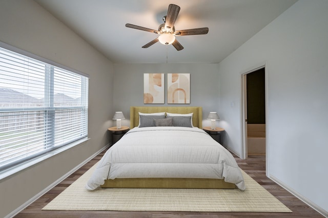 bedroom featuring ceiling fan and dark hardwood / wood-style flooring