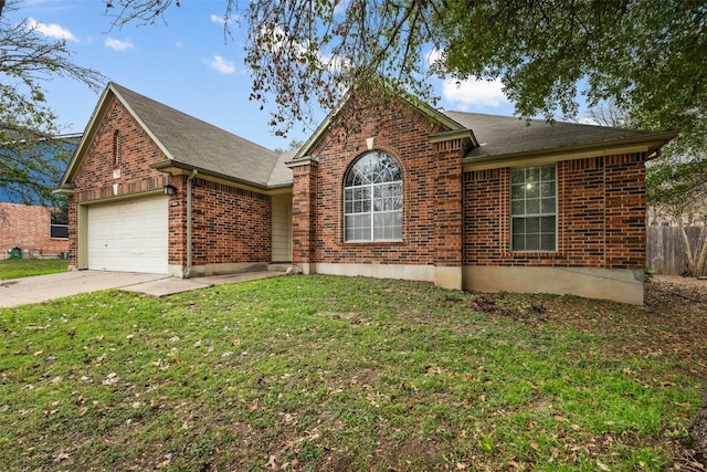 view of front of property featuring a front yard and a garage