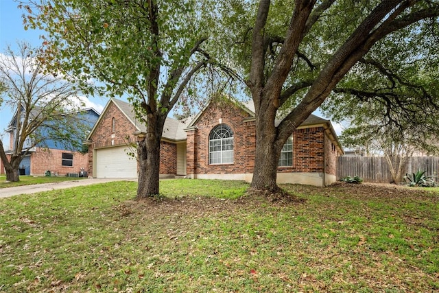 view of front facade with a front yard and a garage