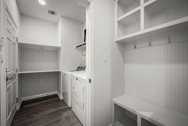 washroom featuring dark hardwood / wood-style floors and independent washer and dryer