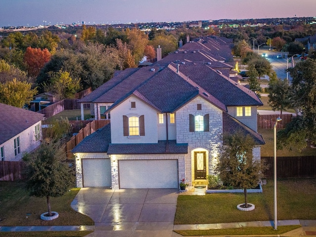 view of front facade featuring a yard and a garage