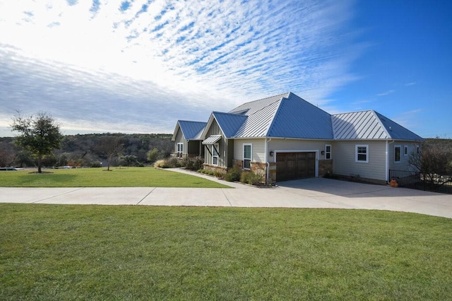 view of front of property featuring a garage and a front yard